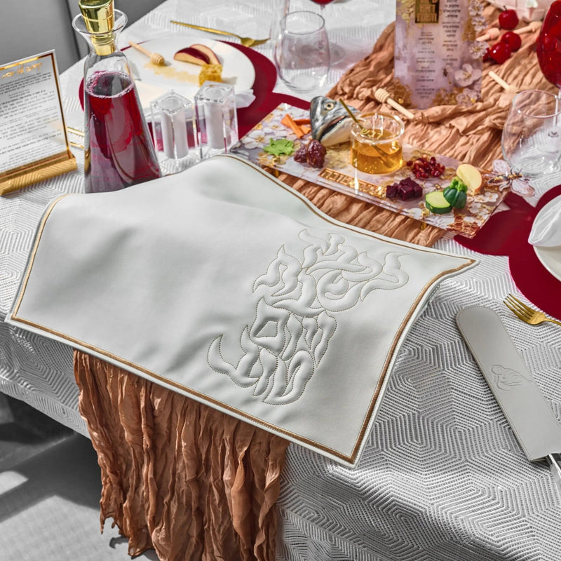 Rosh Hashanah 2025 painted tablescape by Waterdale Collection featuring white embroidered napkins, burgundy runners, and coordinating holiday table settings