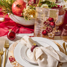 Painted pomegranate Simanim card on a Jewish New Year table setting