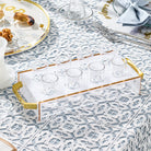 Suspended Pearlstone liquor set featuring a sleek elevated acrylic tray, elegant gold handles, and coordinating shot glasses.