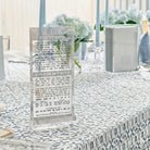 Swirl design kiddush card set on a shabbos table