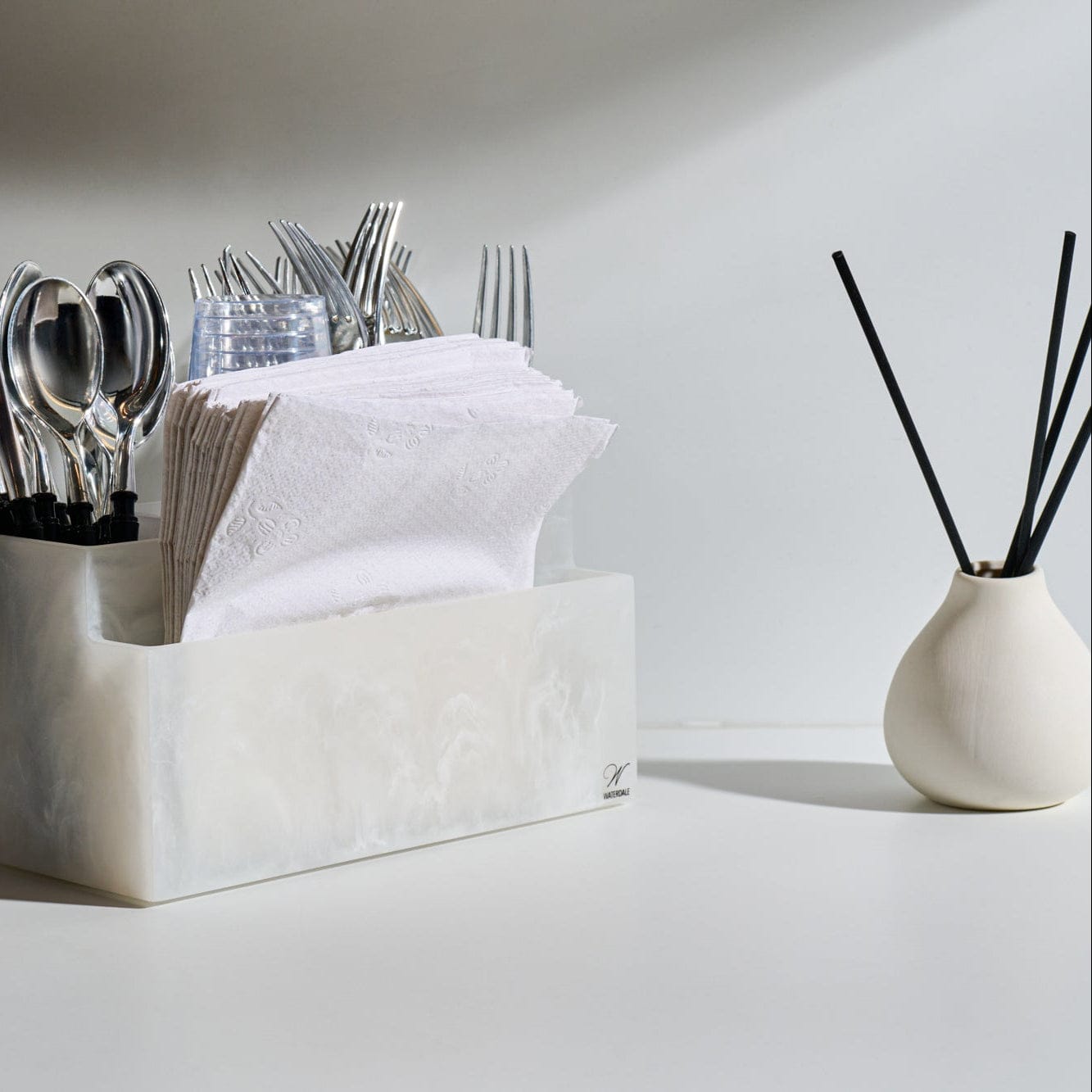 Luxury glass Teardrop reed diffuser styled on a kitchen countertop beside a modern utensil caddy, featuring a minimalist home fragrance aesthetic for a clean, organized kitchen.