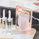 Watercolor Flowers Hadlakos Neiros Block with clear glass candlesticks and white flowers on marble surface for candle-lighting.