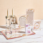 Watercolor Hadlokas Neiros Set by Waterdale Collection featuring glass candlesticks, prayer cards, and matching accessories on marble surface.