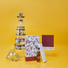 Wine decanter beautifully paired with coordinated treats and packaging for a refined Mishloach Manos presentation.