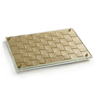Gold woven challah board with glass top and brass accents, featuring an elegant embossed Hebrew design.